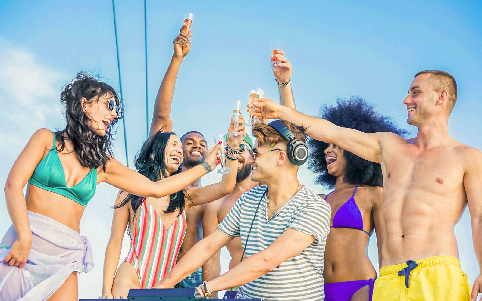Group of people toasting on a boat during Metopi, Agistri & Aegina cruise.
