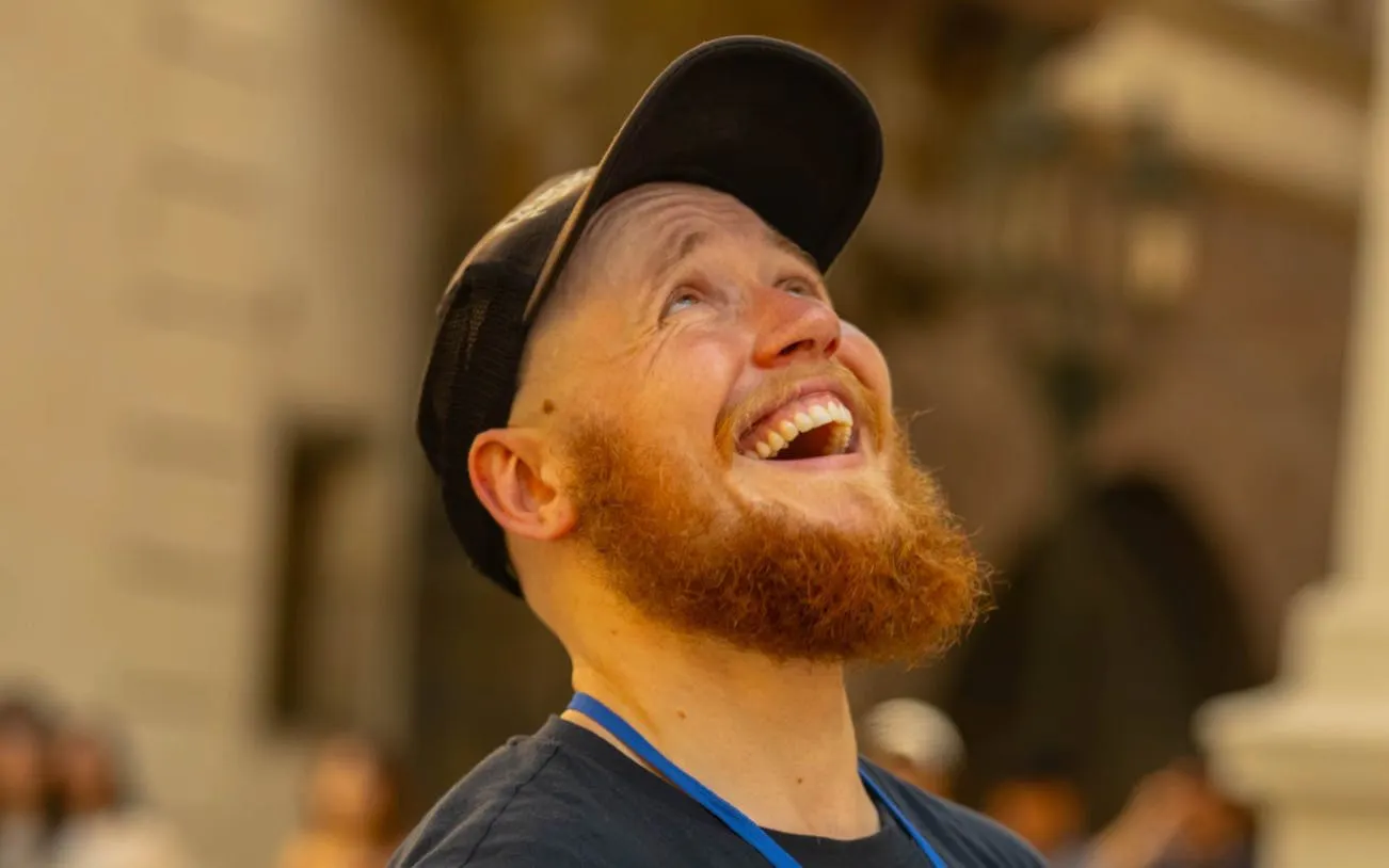 Local guide smiling during Prague walking tour.