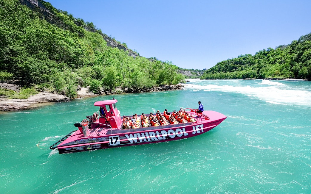Guests enjoying Whirlpool Jet Boat Tour in Niagara Gorge, Canada.
