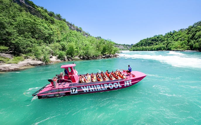 Guests enjoying Whirlpool Jet Boat Tour in Niagara Gorge, Canada.