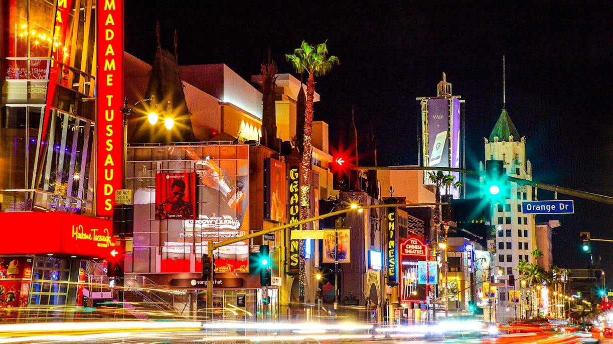 Madame Tussauds Hollywood entrance at night with neon lights on Hollywood Boulevard.