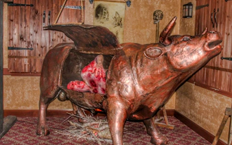 Bronze bull torture device exhibit at Medieval Torture Museum, Chicago.