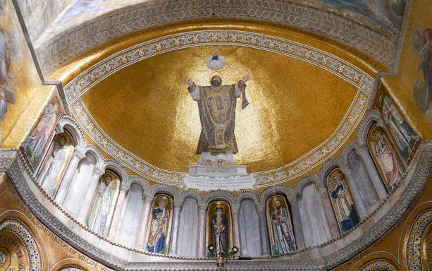 Mosaic ceiling inside St. Mark's Basilica, Venice, featuring religious figures and gold detailing.