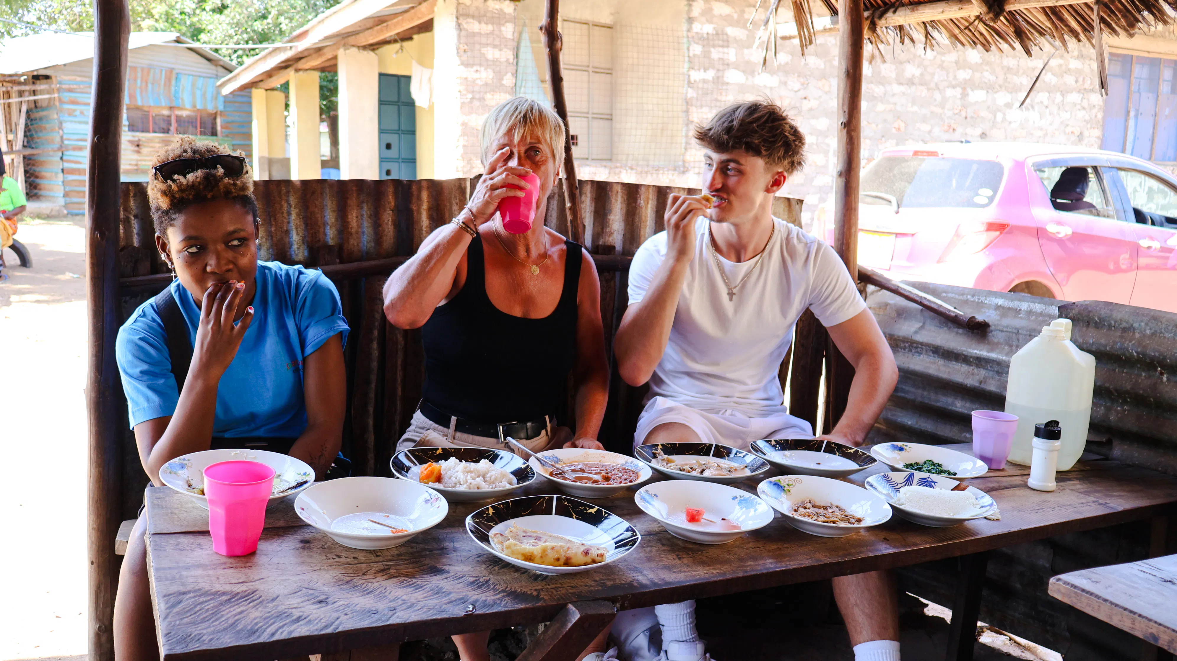 Visitors enjoying local cuisine at a street food stall during the Diani Street Food and Market Tour.