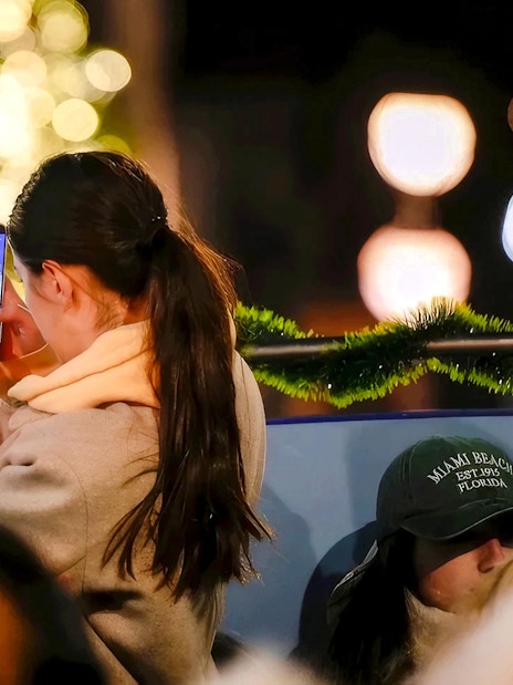 Person taking a photo of Christmas lights in London.