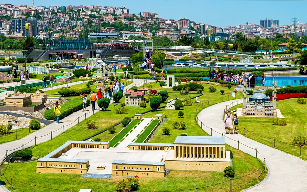 Guests exploring miniature landmarks at Istanbul Miniatürk park.