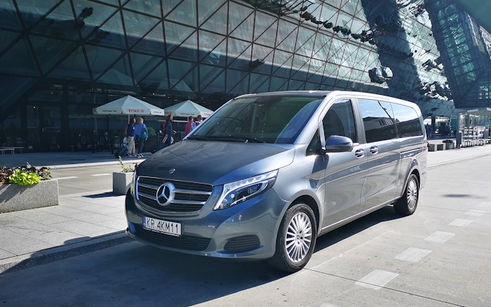 Minivan parked at Gdansk Airport for transfers to Gdynia city.