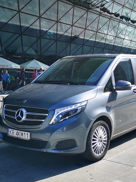 Minivan parked at Gdansk Airport for transfers to Gdynia city.