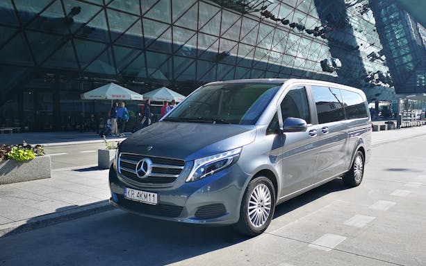 Minivan parked at Gdansk Airport for transfers to Gdynia city.
