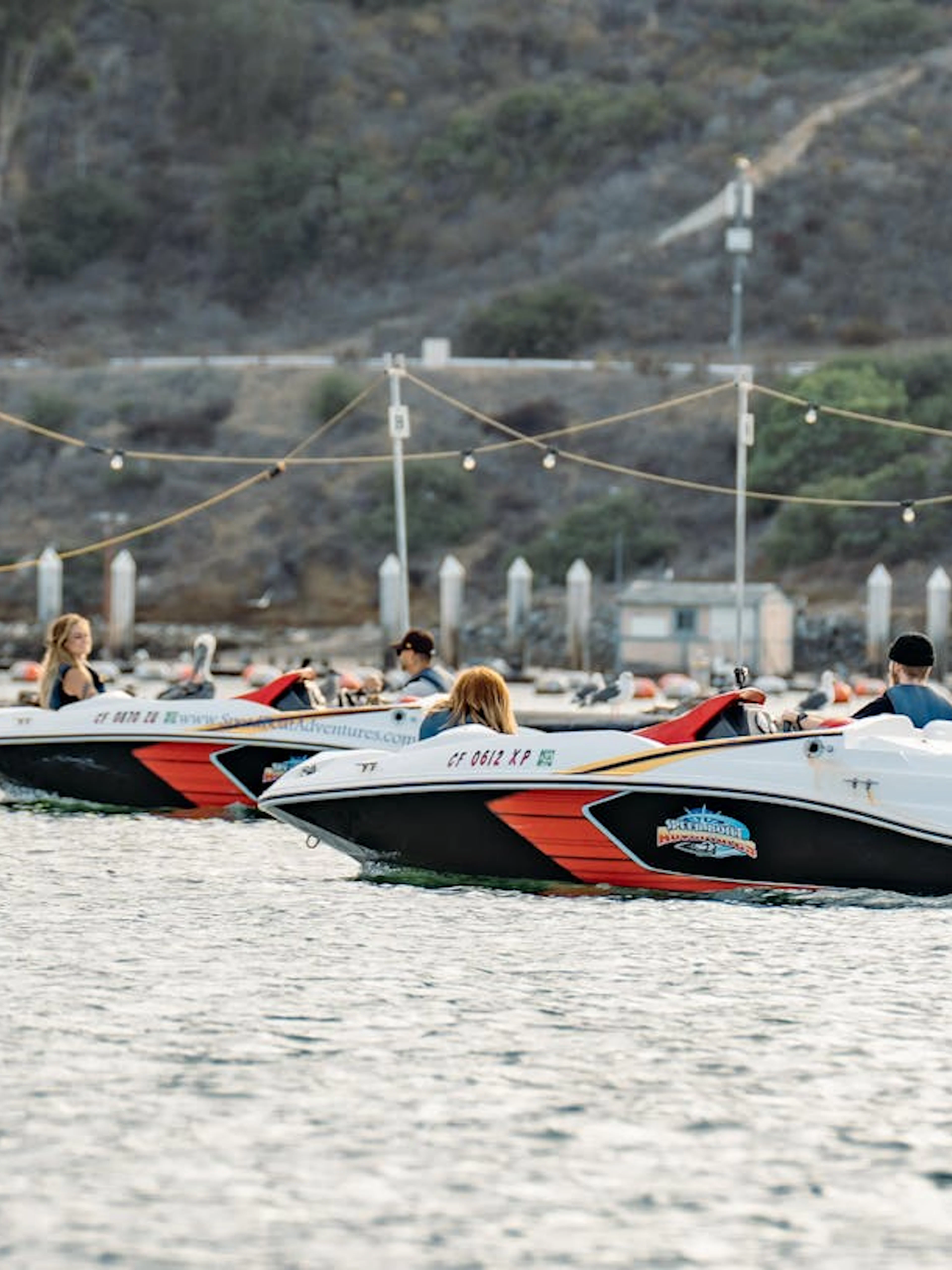 Speed boats on San Diego bay during adventure tour.