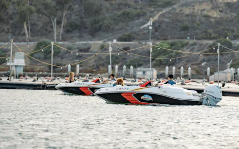 Speed boats on San Diego bay during adventure tour.