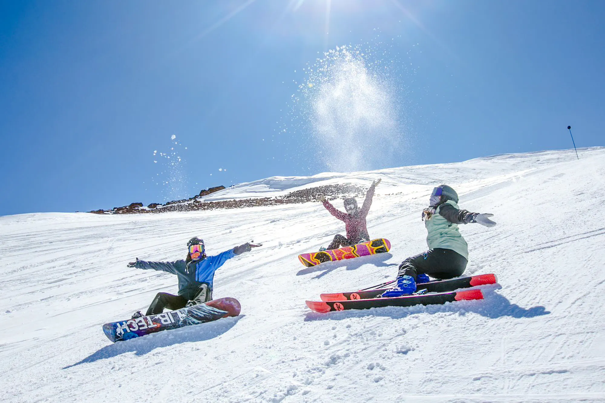 Snowboarders enjoying a sunny day at El Colorado Ski Resort, Santiago.