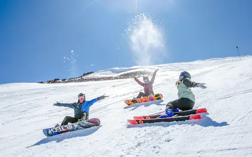 Snowboarders enjoying a sunny day at El Colorado Ski Resort, Santiago.