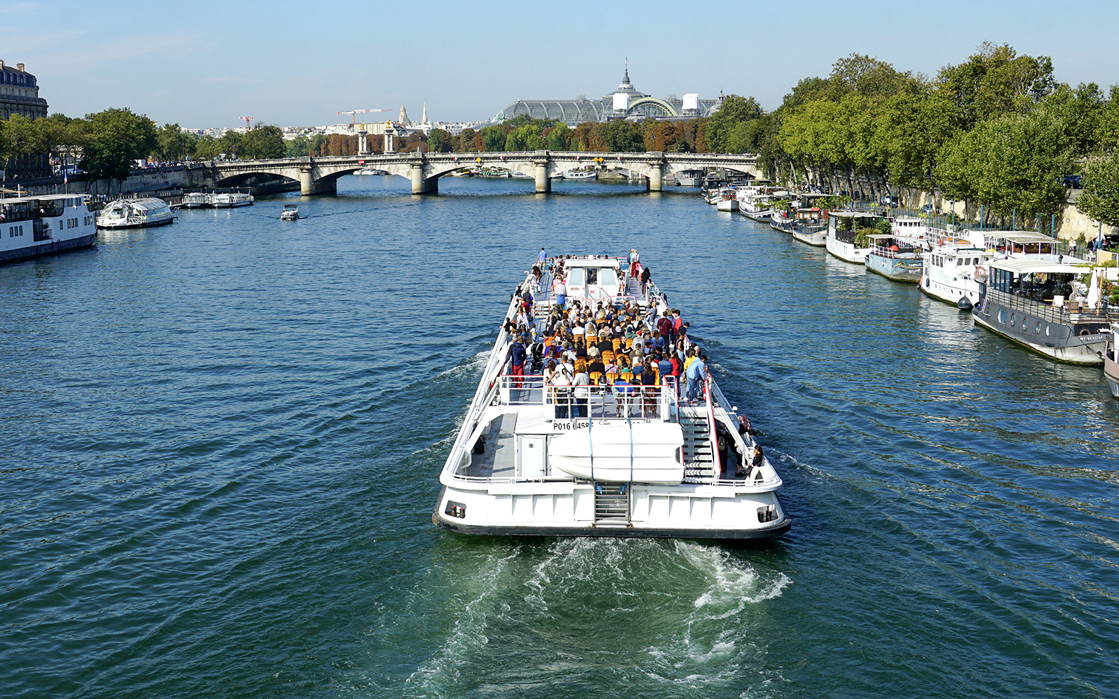 Sightseeing cruise boat on the Seine River near Canal St Martin, Paris.