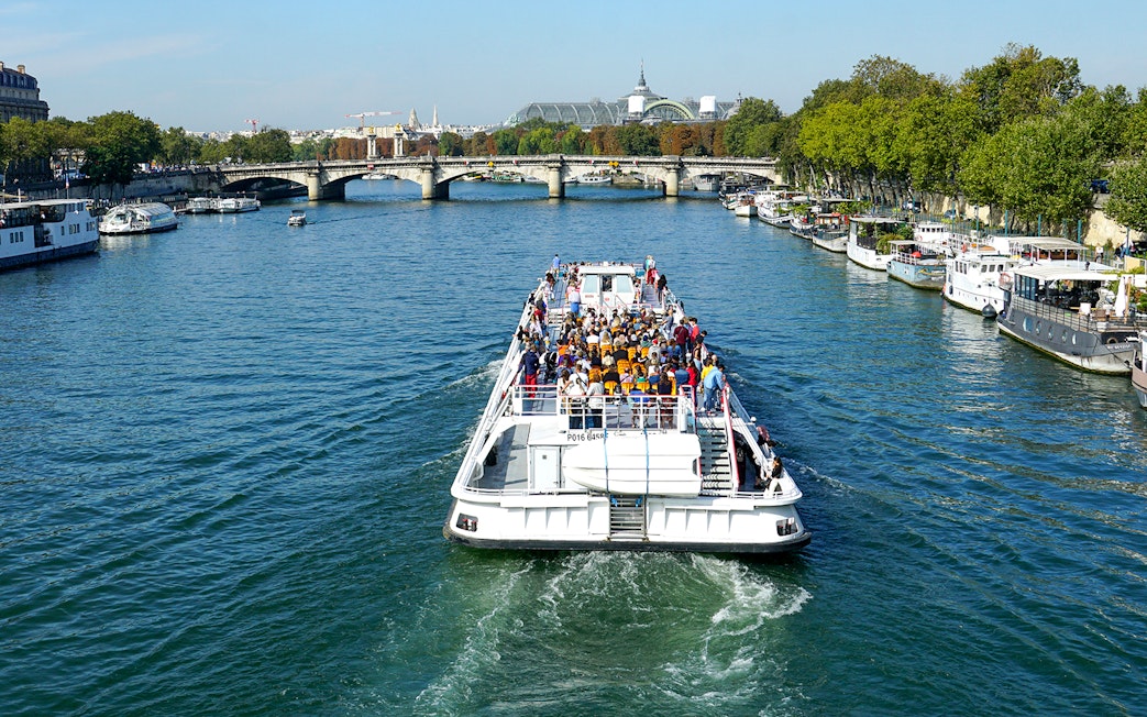 Sightseeing cruise boat on the Seine River near Canal St Martin, Paris.