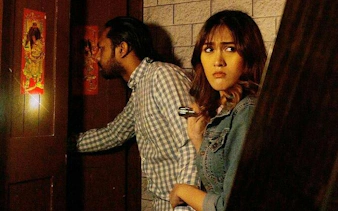 Participants exploring Breakout Avenue K's Chamber of Hocus escape room in Dubai.