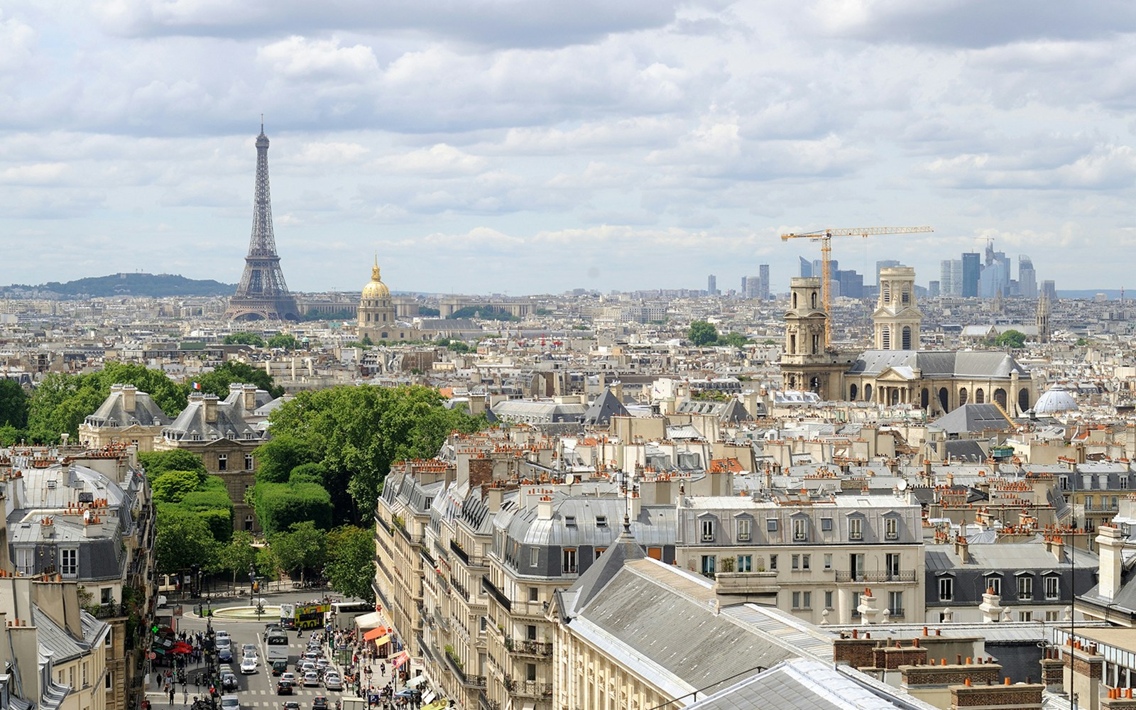Paris skyline view with Eiffel Tower and Pantheon Dome in the distance.