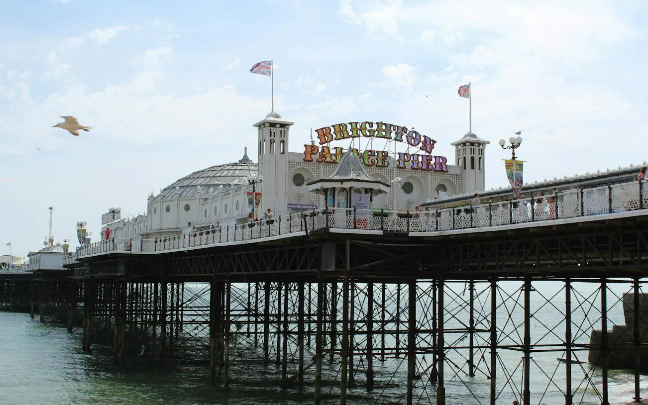 Brighton Palace Pier with seagull flying above, part of self-guided city exploration game in Brighton.