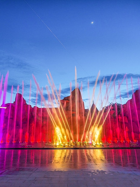 VinWonders Nha Trang colorful fountain show at night with castle backdrop.