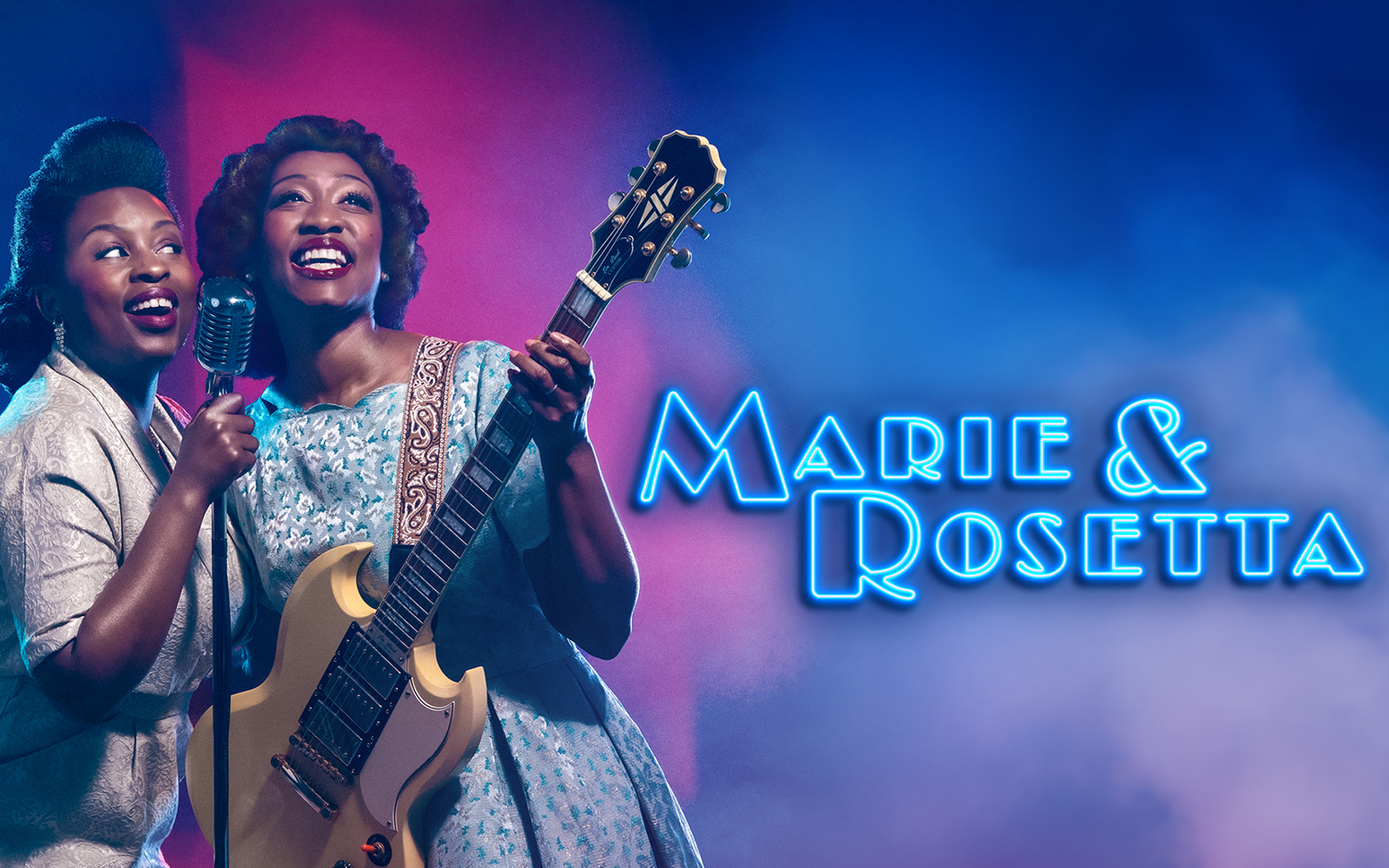 Two performers on stage with a guitar and microphone, Marie & Rosetta show.