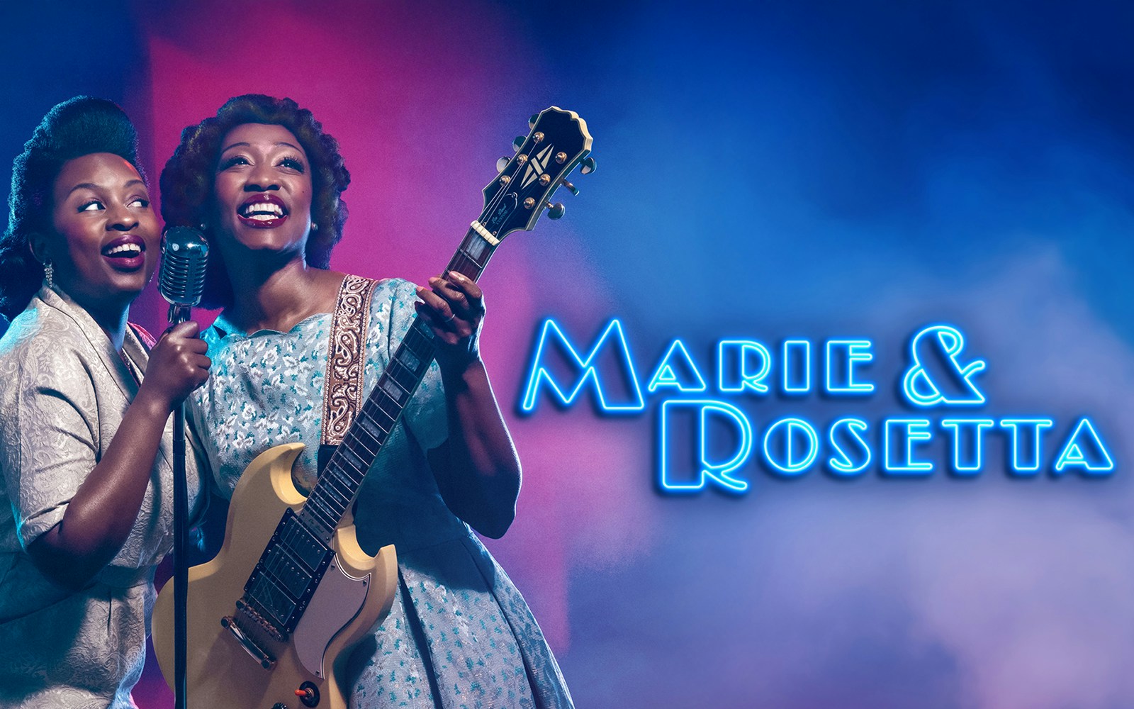 Two performers on stage with a guitar and microphone, Marie & Rosetta show.