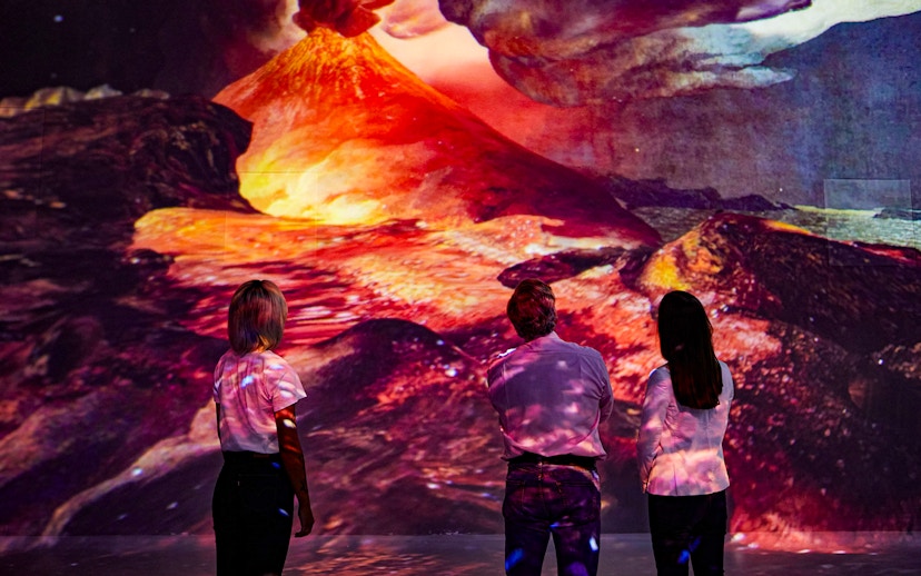 Visitors viewing Vesuvius eruption at Frameless Immersive experience.