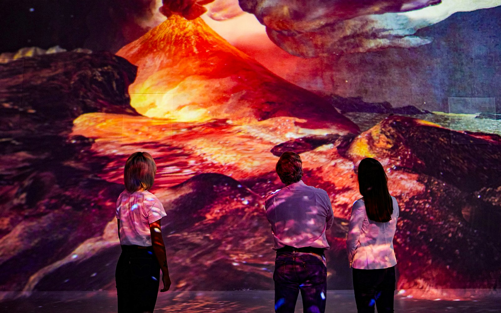 Visitors viewing Vesuvius eruption at Frameless Immersive experience.