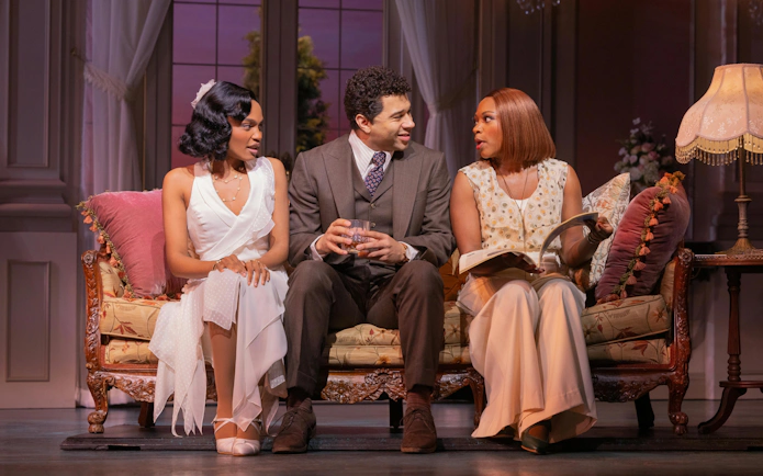 Actors in a living room scene from The Great Gatsby musical on Broadway.