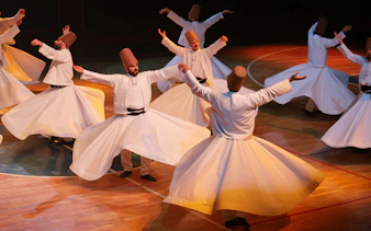 Whirling dervishes performing traditional dance in Turkey.