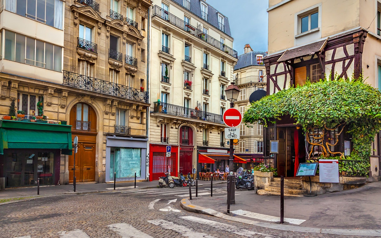 Montmartre street with shops and cafes, Paris.