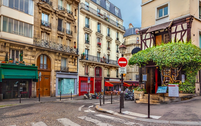 Montmartre street with shops and cafes, Paris.