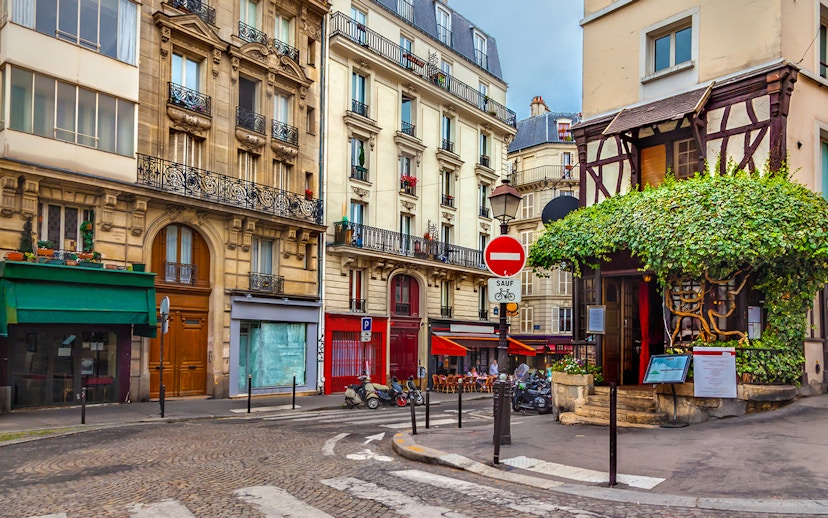 Montmartre street with shops and cafes, Paris.