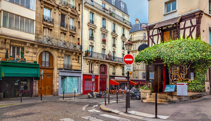 Montmartre street with shops and cafes, Paris.