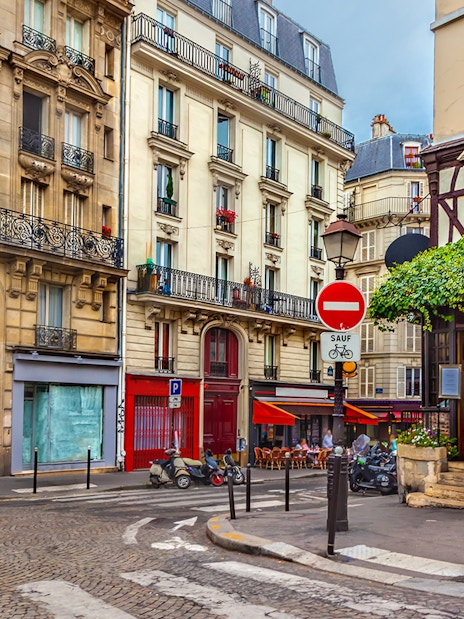 Montmartre street with shops and cafes, Paris.