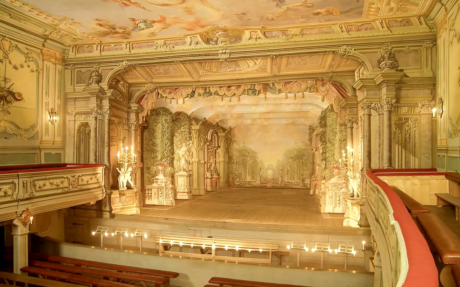 Baroque castle theatre interior in Cesky Krumlov with ornate stage and seating.