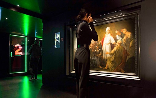 Visitor viewing artwork at Moco Museum, Amsterdam.
