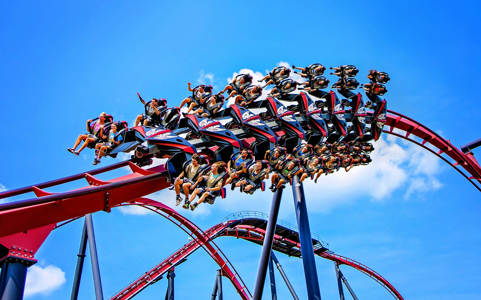 Riders on X Flight roller coaster at Six Flags Great America.
