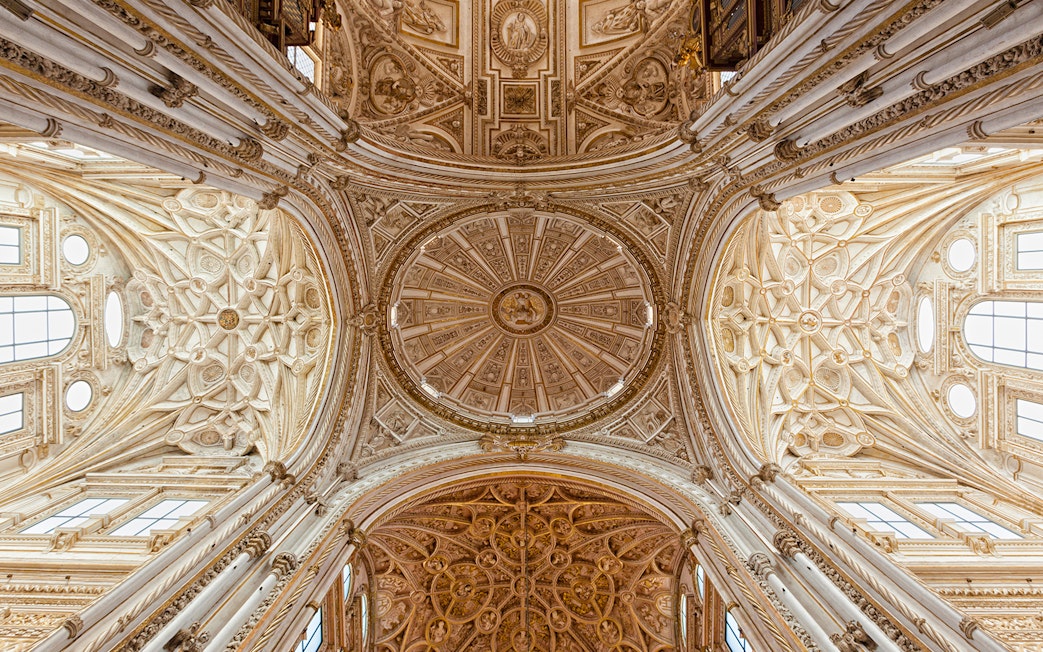Ceiling of the Mosque-Cathedral of Córdoba, intricate design, viewed on a day trip from Seville.