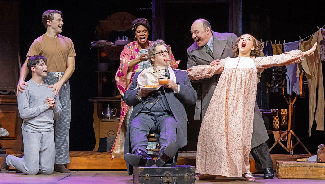 Theater cast performing a scene from the musical "Gypsy" on stage.