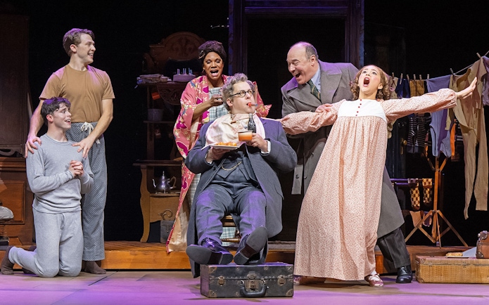 Theater cast performing a scene from the musical "Gypsy" on stage.