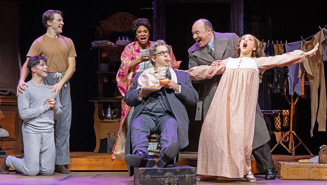 Theater cast performing a scene from the musical "Gypsy" on stage.