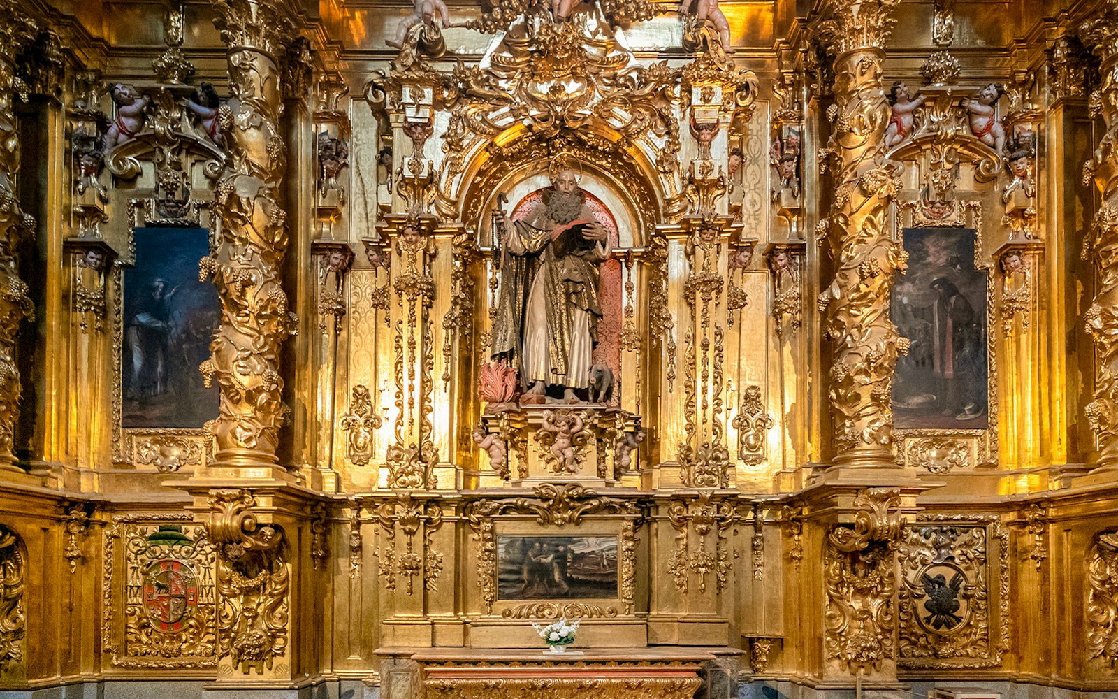 Segovia Cathedral Chapel of Santiago ornate altar with gold detailing and religious statue.
