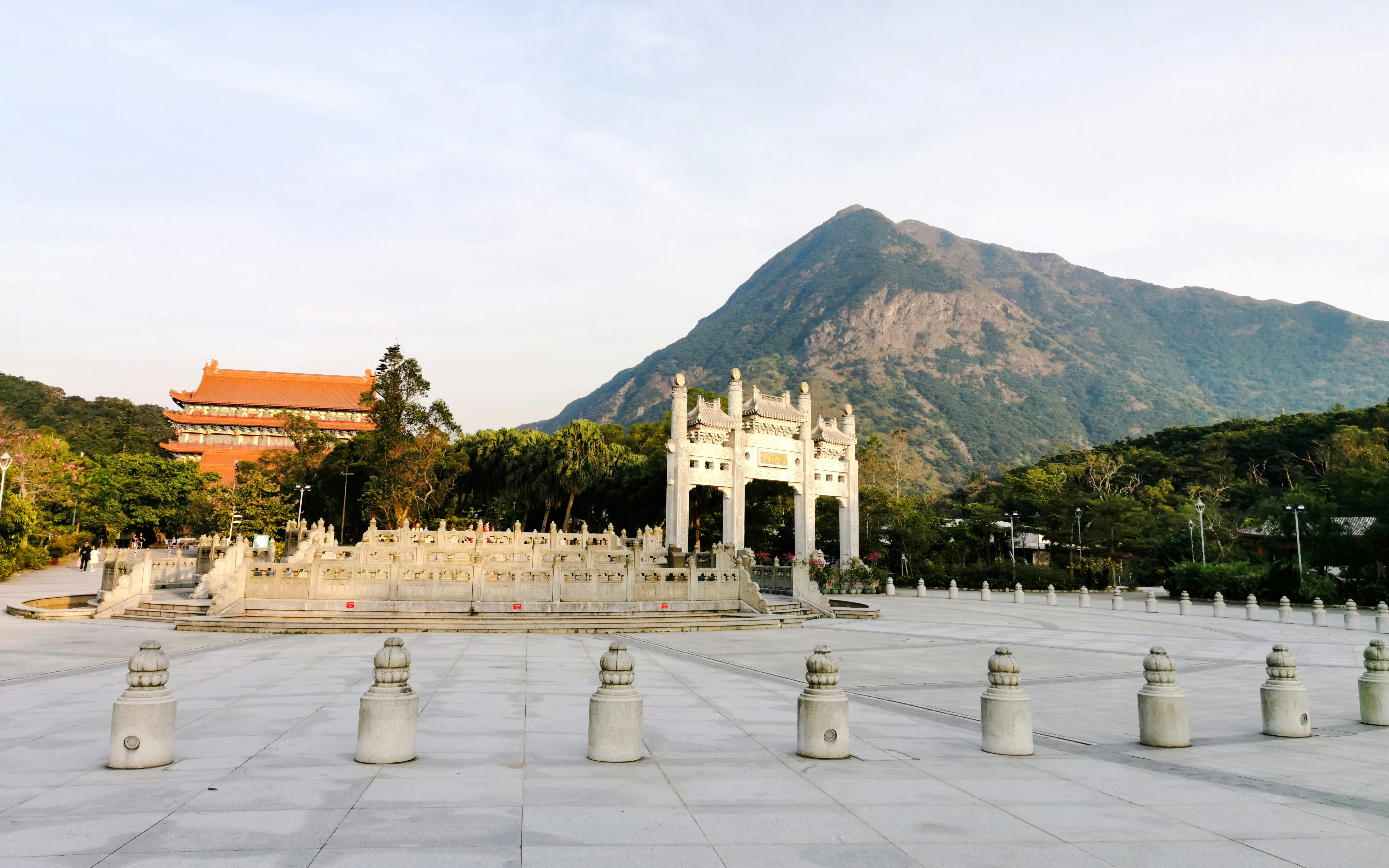Ngong Ping Piazza with mountain backdrop near Ngong Ping 360 Cable Car, Hong Kong.