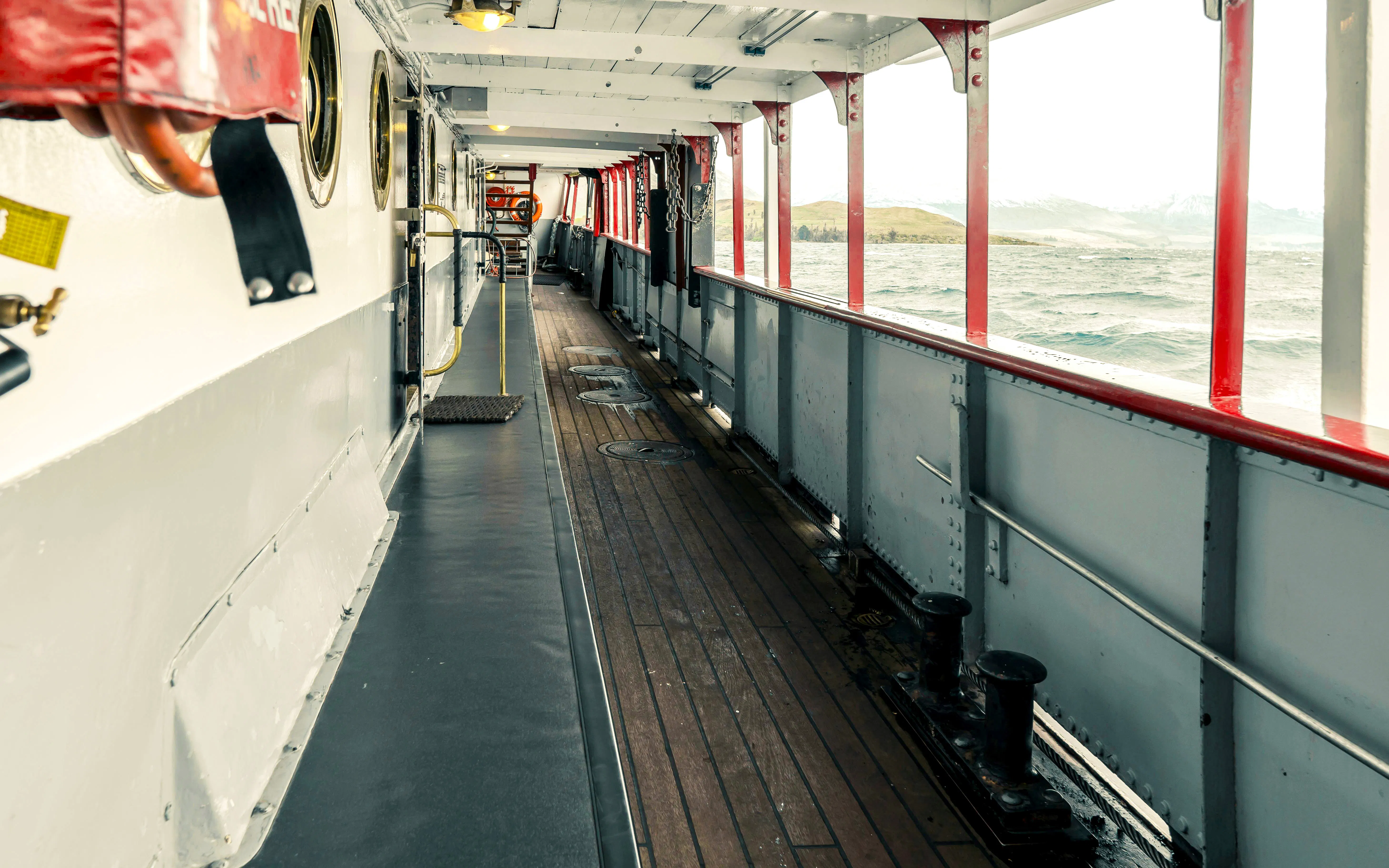 TSS Earnslaw steamboat deck with lake view during cruise.