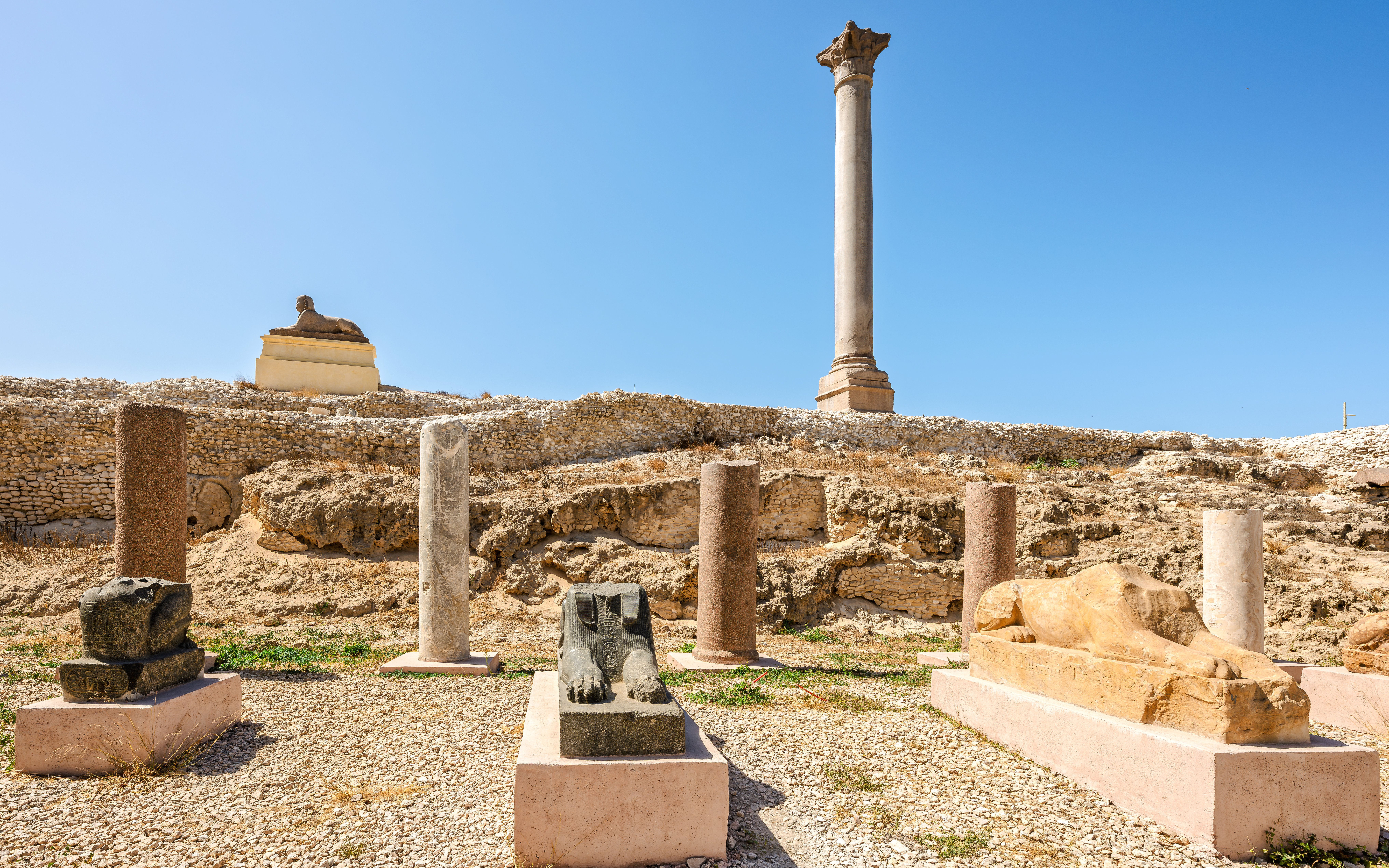 Ancient Roman column and Egyptian sphinxes at Pompey's Pillar site, Alexandria, Egypt.