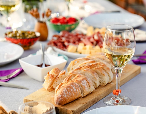 Wine and charcuterie spread on a table in Paris, France.