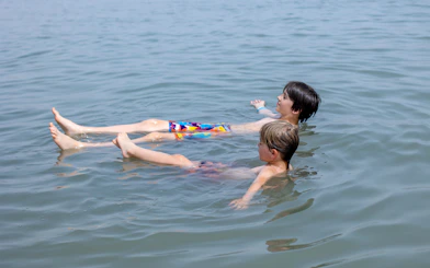 Children floating in the Dead Sea, Israel.