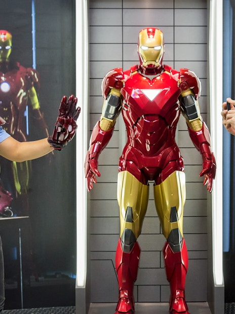 Visitor posing with Iron Man figure at Madame Tussauds Singapore.