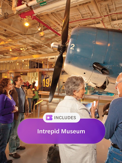 Visitors exploring aircraft exhibit at Intrepid Museum, New York City.