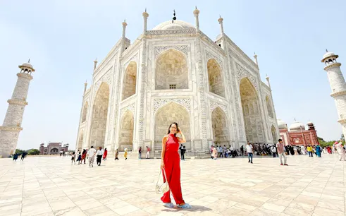 Taj Mahal with visitors during sunrise on a private day tour from Delhi, Agra.